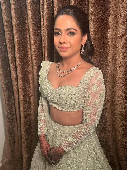 A final portrait from her Sangeet. The makeup is clean, radiant, and perfectly suited for a modern bride.
