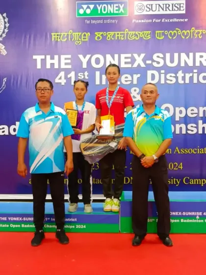 **Podium Moment at the State Open.** Our champion Chanu on the podium receiving her award at the 41st Inter-District & 68th State Open Badminton Championships.