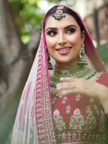 A beautiful outdoor bridal shoot. Students learn how to adapt makeup for different lighting conditions, ensuring the bride looks flawless whether indoors or in natural daylight.