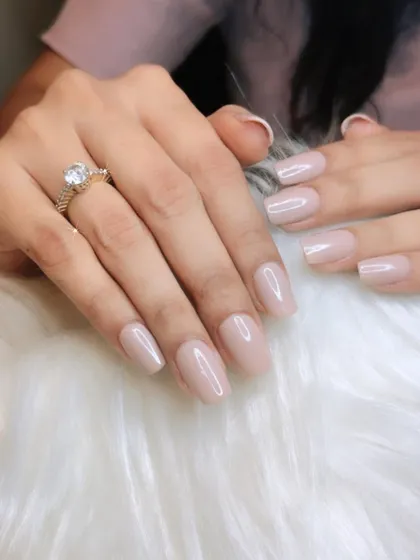 A perfect nude manicure. I work with you to find the most flattering nude shade for your skin tone, creating a clean, elegant, and elongated look.