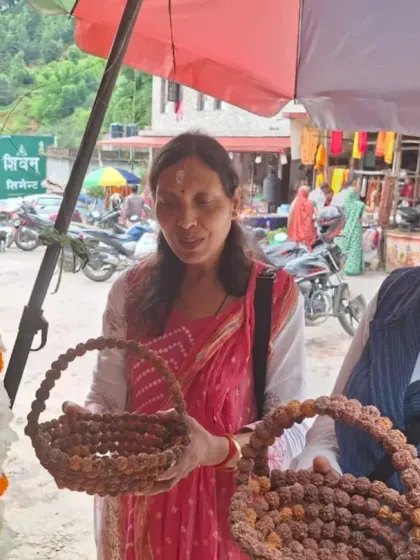 Two women from our group looking at Rudraksha items sold by local vendors. These sacred beads are a powerful tool for a seeker's journey.