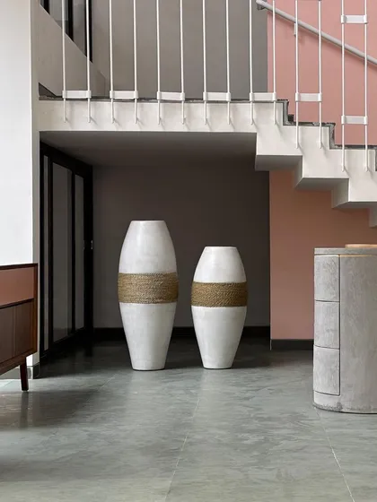 The 'Tali' planter is a perfect example of modern chic from my GRC range. The combination of a clean white finish and a rustic rope band creates a sophisticated look, seen here in a stunning architectural project.