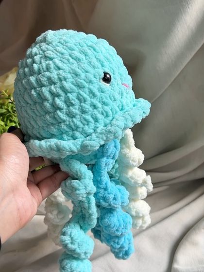 This is our jellyfish crochet toy, made with soft chunky yarn. The curly tentacles are fun to touch and provide a great sensory experience for kids.