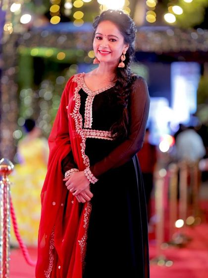 Actress Duniya Rashmi looking graceful in a black and red Anarkali at the Chittara Star Awards. I focus on capturing both the outfit and the personality.