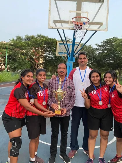 Celebrating with some of the key players and the championship trophy. Moments like these are the culmination of months of rigorous training and team development.