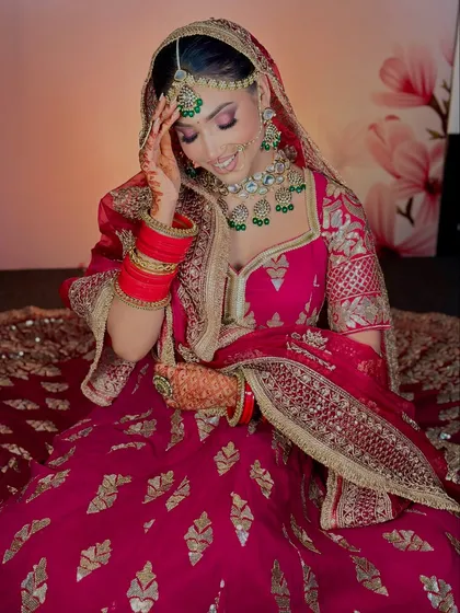 A candid moment captured. The makeup looks fresh and beautiful, even in a more relaxed pose.