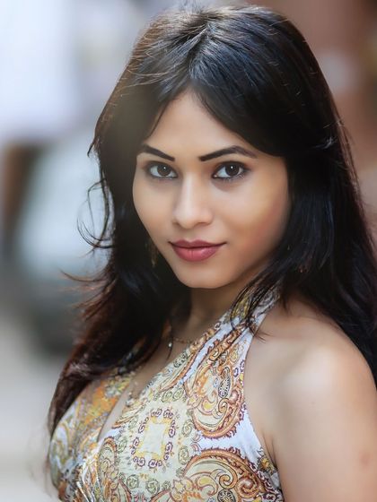 A stunning close-up that captures her beautiful features and direct, engaging gaze.