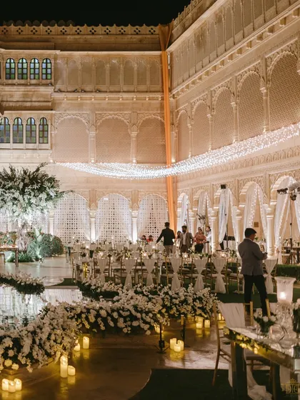 Another perspective of the stunning all-white reception at Suryagarh. The combination of white florals, candlelight, and the palace's architecture created a breathtaking scene of elegance and sophistication.