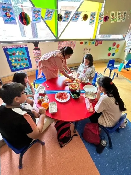 Teamwork and cultural learning come together in our Little Chefs program. Here, a group of campers collaborates to prepare Bhel Puri, a popular Indian snack, learning about different ingredients and the importance of hygiene and cooperation in the kitchen.
