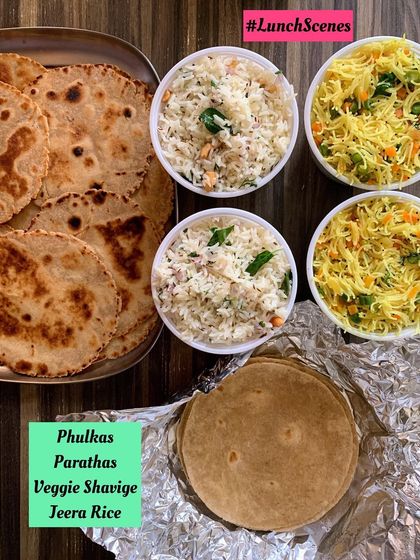 A simple lunch of Phulkas, Parathas, Veggie Shavige, and Jeera Rice.