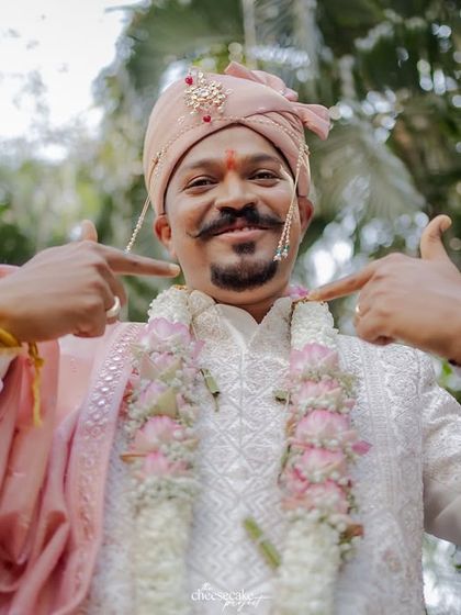 That main character energy! Capturing the groom's fun and confident personality during his baraat is always a blast.