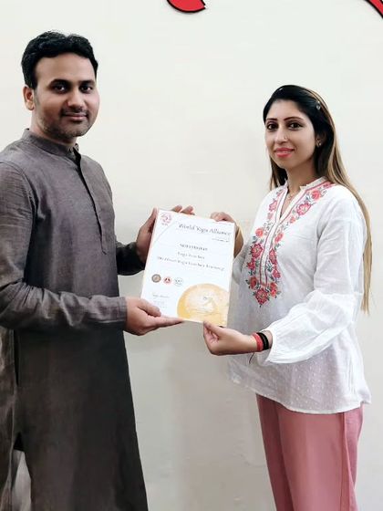 This student proudly holds her 200-hour YTTC certificate. We wish her all the best as she begins to share her knowledge.