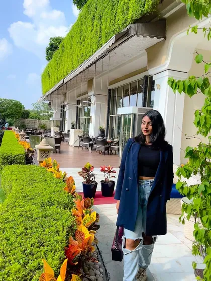 Taking a moment outdoors. This outfit shows how power dressing doesn't have to be confined to the boardroom; it's a style that works anywhere.