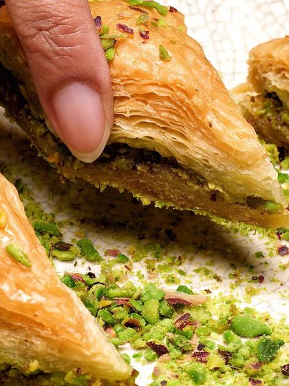 A close-up of our authentic Baklava. Each bite, filled with finely crushed pistachios, transports you to the lanes of Turkey.