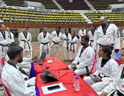 Here, I am conducting an examination for participants at the National Kyorugi Referee Seminar in Odisha. This process involves evaluating their understanding of the rules and their ability to apply them correctly under pressure.