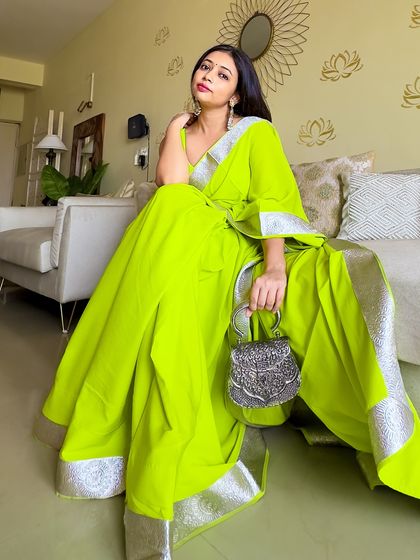 Neon is a color that's never going out of style for me. This custom neon green saree with a silver lapa border is a timeless piece that looks chic every time I wear it. It’s all about finding colors that make you shine.