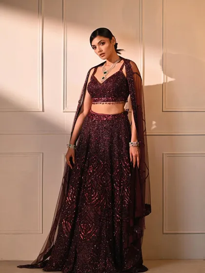 This full-length shot captures the elegance of a modern reception lehenga. I directed the pose to showcase the flow of the garment and the intricate sequin work, creating a sophisticated image for a fashion lookbook.