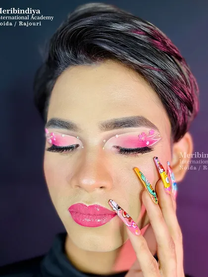 We encourage you to express your creativity by combining makeup with nail art. This look features pop-art inspired nails that complement the floral-themed creative eye makeup.