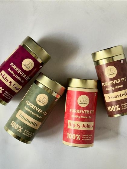 A beautiful display of my four signature cookie tins: Skin & Coat, Immunity, Hip & Joints, and Assorted. Each one is packed with goodness and ready to ship anywhere in India.