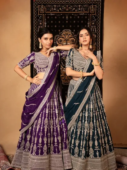 A classic lookbook shot for a lehenga brand, showcasing two different colorways of the same design. The setup is clean and allows customers to easily compare the options.