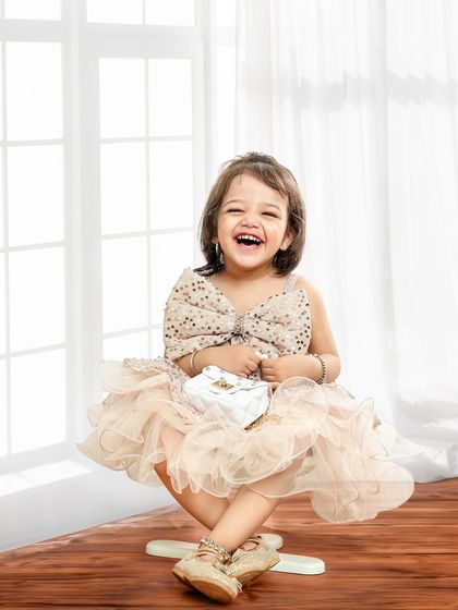 This portrait captures a big, hearty laugh. The simple, bright setting ensures that nothing distracts from this moment of pure happiness.