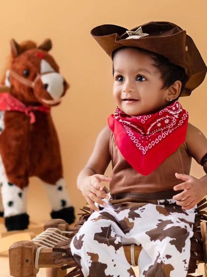 Another angle from the cowboy series, capturing a sweet, curious expression. I take a variety of shots during each session to give you a full gallery of moments.