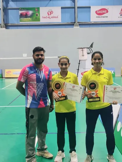 Aditi Yadav and her partner, U13 Girls Doubles winners at the Maharashtra State Selection Tournament, with their coach.