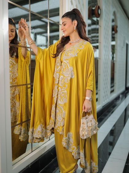 A stunning look in a beautiful yellow kaftan. The makeup is soft and glowing, ready to turn heads.