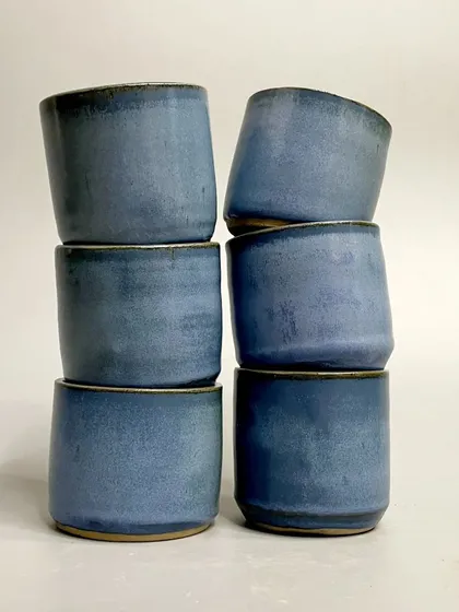 A stack of the rustic blue tumblers. The elegance of the form combined with the unique glaze makes each piece extraordinary.
