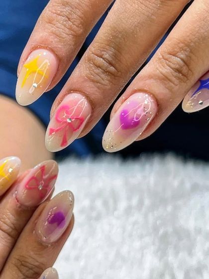 Another angle of the playful aura set, highlighting the different colors and cute designs on each nail.