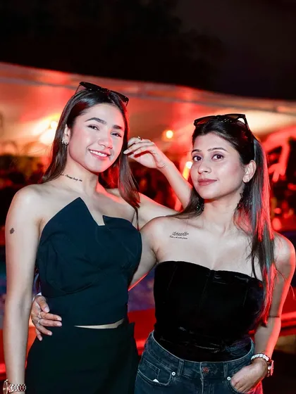 Guests posing for a photo at the Halloween Sundowner. The vibe is always friendly and full of happy people.