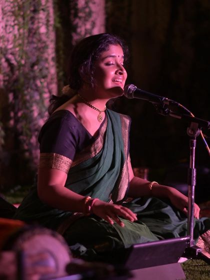 A close-up from a magical evening performance at Namma Ashram. The ambient lighting and serene environment made this concert a truly special and soulful experience.