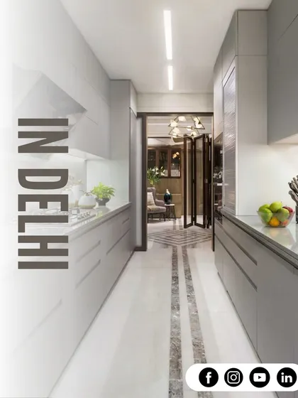 A perfect example of a galley kitchen layout. We used light grey handleless cabinets and a clean white countertop to make this narrow space feel bright, open, and highly functional.