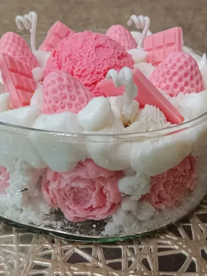 A side view of the ice cream bowl candle, showing the addition of wax roses at the base.
