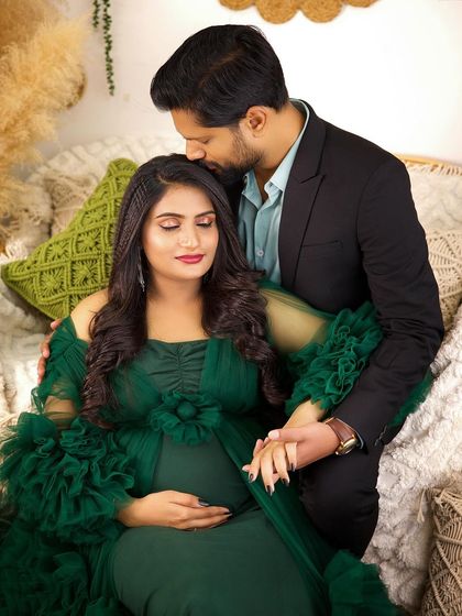 A cozy and intimate moment in our boho studio. The husband's loving embrace and the warm, natural setting create a beautiful and heartfelt portrait.