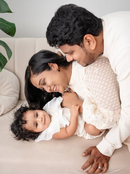 A playful and loving moment on the couch. I love capturing families interacting naturally and having fun together.