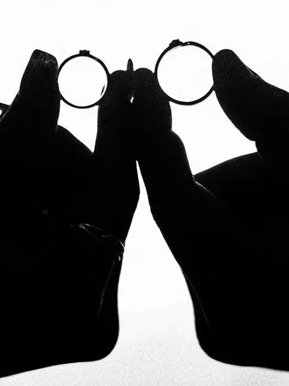 I love finding creative ways to photograph the details. This silhouette shot of the couple holding their wedding rings is simple, artistic, and symbolic of their union. It turns a detail shot into a piece of art.