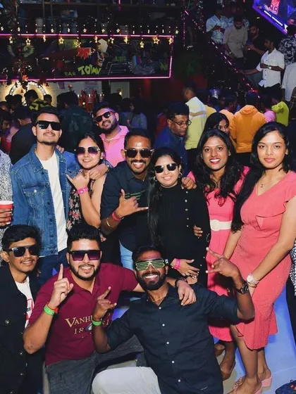 Themed nights sometimes mean fun accessories. This group is rocking sunglasses and having a great time.