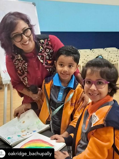 Posing with some of the talented young artists from Oakridge. Their smiles and colorful drawings made my day.