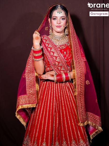 A full length view of another classic red bridal look. I ensure my students practice on different models and with various outfits to build a diverse and professional portfolio.