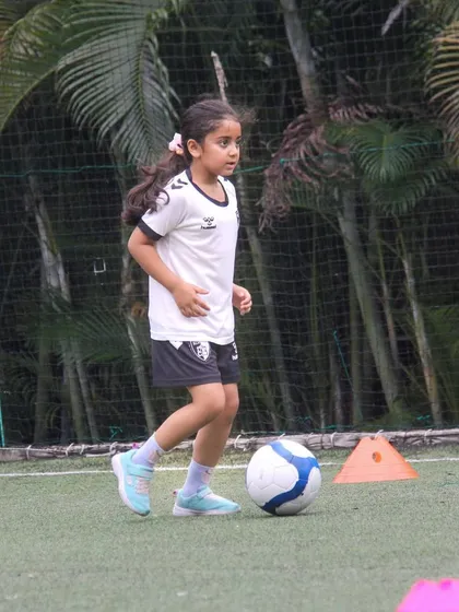 With every kick and every drill, our players get closer to their goals. This young athlete is practicing her dribbling, building the muscle memory needed for competitive play.