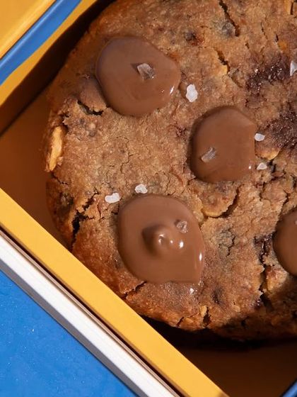 Our Super Dad Cookie Box, filled with chunky, gooey chocolate chip cookies. A simple and delicious way to make his day special.