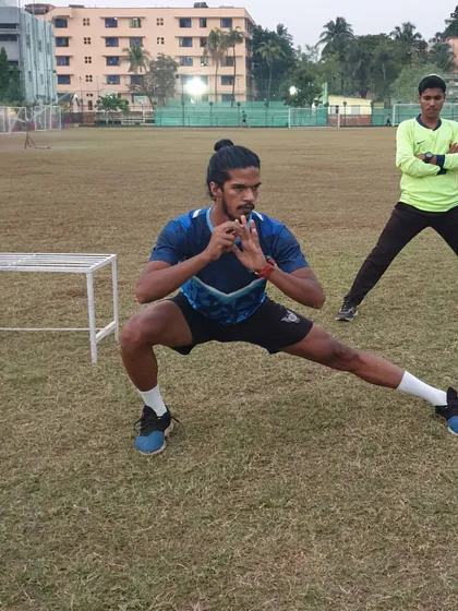 An athlete performs a side lunge, an important exercise for strengthening the adductors and improving stability in the frontal plane.