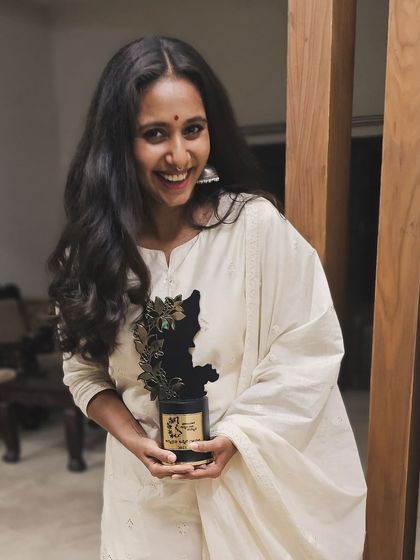 Holding the Prajavani Cine Samman award. I am so thankful for all the love and support from my audience and the critics.