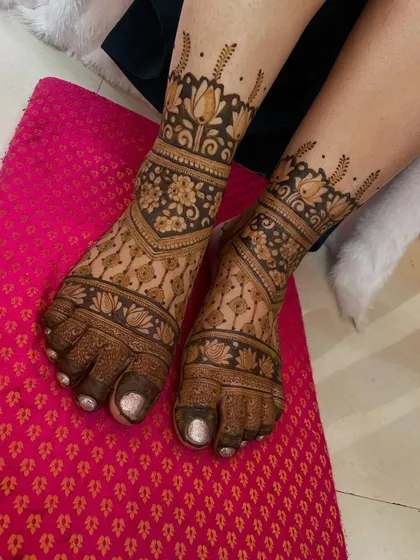 A full-coverage floral design for the feet, with bands of lotuses and other traditional flowers.