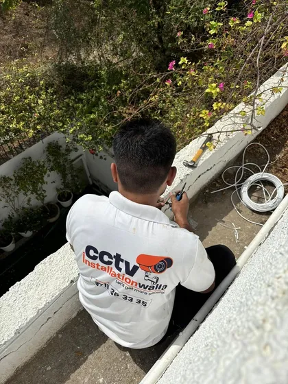 Finalizing the connections for an outdoor camera installation in DLF, Gurgaon. Attention to detail at every step is what makes our installations last.