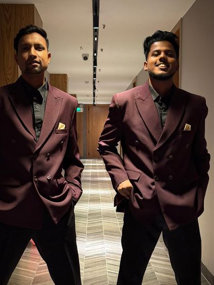Our male performers looking sharp in matching maroon suits. We ensure our team's presentation is always top-notch.