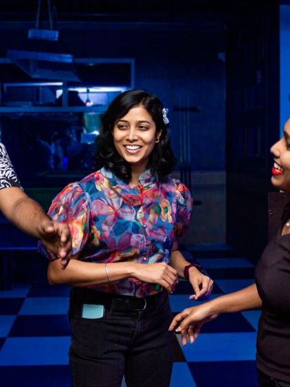 Friends dancing together, creating their own little world on the dance floor.