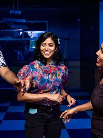 Friends dancing together, creating their own little world on the dance floor.