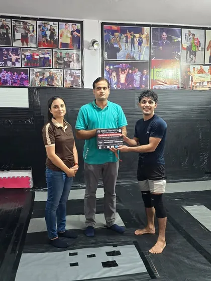 The hard work pays off. One of our team members receiving his certificate and medal after a successful grappling competition.
